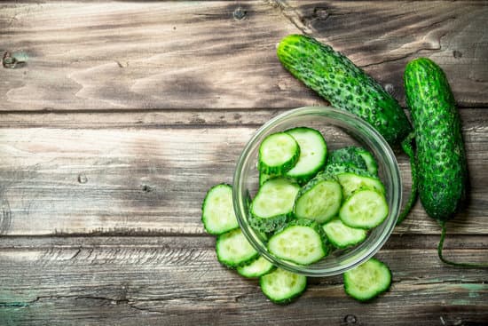 canva pieces of fresh cucumbers in the bowl. MAEPmDr3TCA