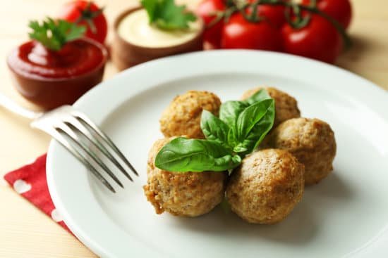canva plate of meatballs with basil MAD MXTpa0o