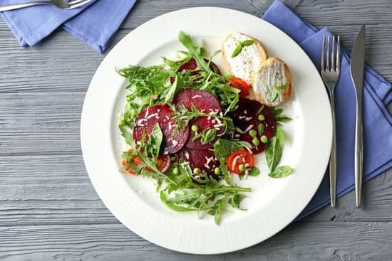 canva plate with useful beet salad on wooden background MAD9bsRVNhA
