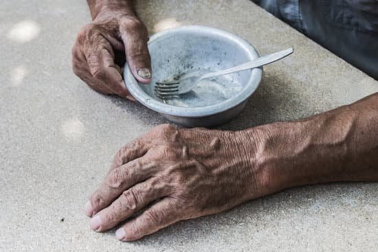 canva poor old mans hands with an empty bowl MAD XAmXy4Y