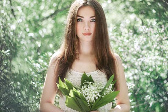 canva portrait of young woman with lily flowers MAEO qD8H9M