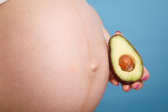 canva pregnant woman holding half of avocado next to her belly MAEAv8tF9s0