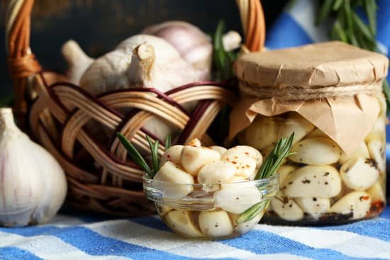 canva preserved garlic with herbs and spices MAD MIdPfLQ