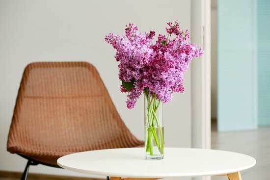 canva purple lilac flowers on white wooden table MAD QoKsPdI