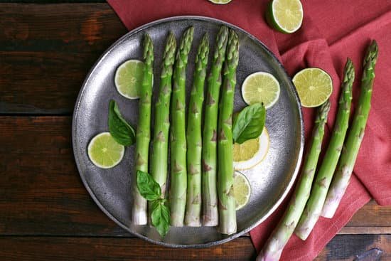 canva raw asparagus with lime slices flat lay MAD MTyFkH8