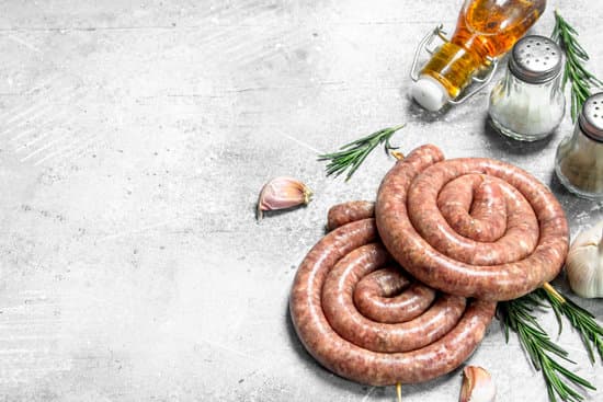canva raw sausages with seasonings and herbs