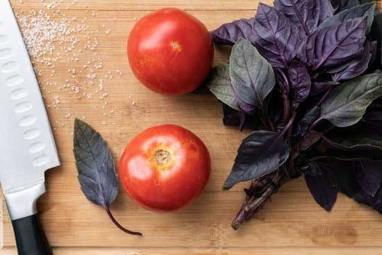 canva red tomatoes and purple basil leaves on wooden cutting board MAEB2I2ph4Q