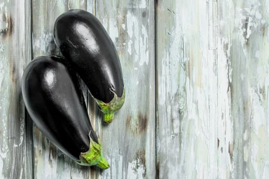 canva ripe eggplants on wooden board MAEPcA6jk54