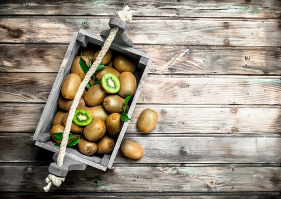 canva ripe kiwi in a wooden box. MAEPgm0DlYw