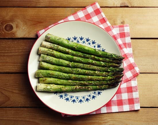 canva roasted asparagus on plate on table MAD MdhYQ4E