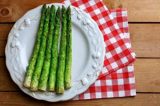 canva roasted asparagus on plate on table background MAD MZsGkQo