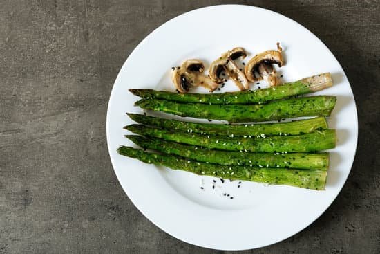 canva roasted asparagus with mushrooms on plate MAD MRiCLKQ