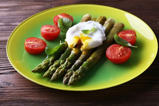 canva roasted asparagus with tomatoes and poached egg on plate MAD MZQRznM