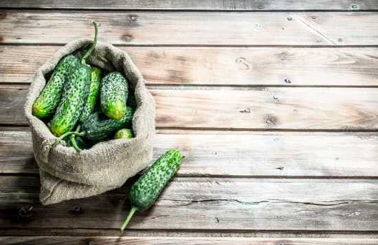 canva sack of cucumbers on a wooden table MAEPRyUqPso