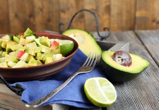canva salad with apple and avocado in bowl MAD MMAb iI