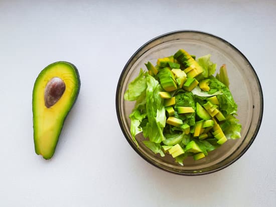 canva salad with avocado and sesame seeds oil is poured MAEPuzaydJY
