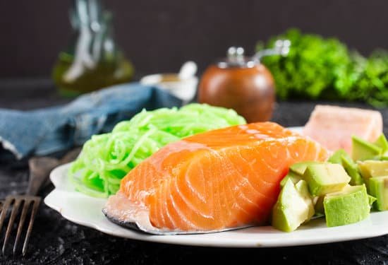 canva salmon with avocado and noodles on plate MAD 1J8iVAQ