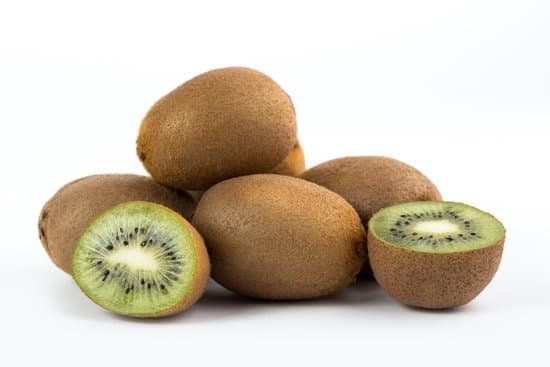 canva sliced and unopened kiwis on white background MAD70qWUQEA