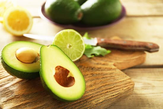 canva sliced avocado and lime on a cutting board MAD MUbH4iI