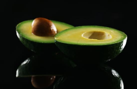 canva sliced avocado on black background MAD QpQaybs