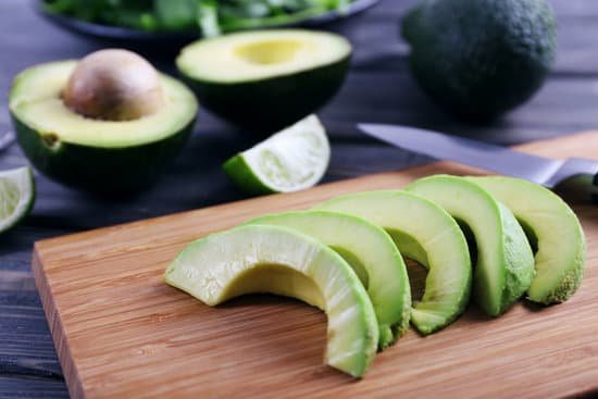 canva sliced avocado on cutting board close up MAD QpWkkNw