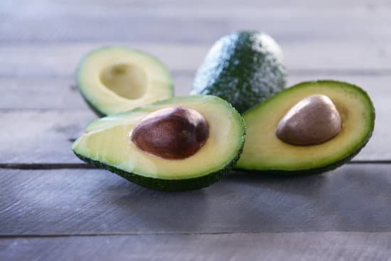 canva sliced avocados on wooden background MAD QghMNp8