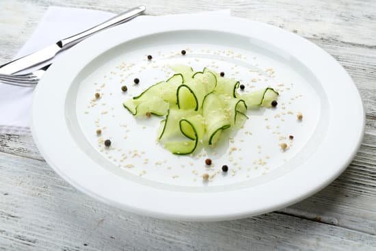 canva sliced cucumber dish on white plate MAD Mt7KJUY