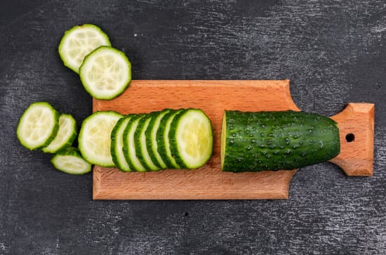 canva sliced cucumber on a cutting board MAD gfb8jpY