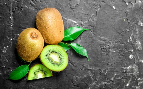 canva sliced fresh kiwi with leaves on stone background MAEPgpvTNu0