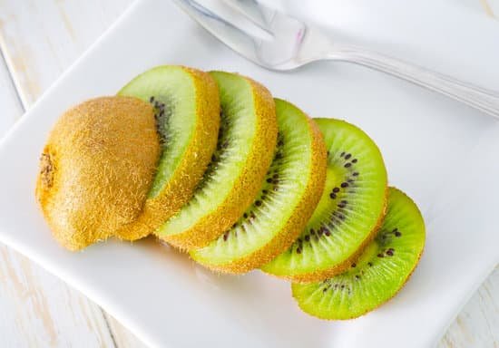 canva sliced kiwi in white chopping board MADhAzcQaZQ