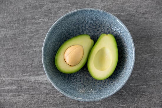 canva sliced ripe avocado with bone in ceramic bowl MAEQQhx 2w