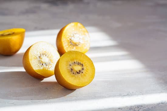 canva sliced yellow kiwi halves on gray background MAEHGf MoR0