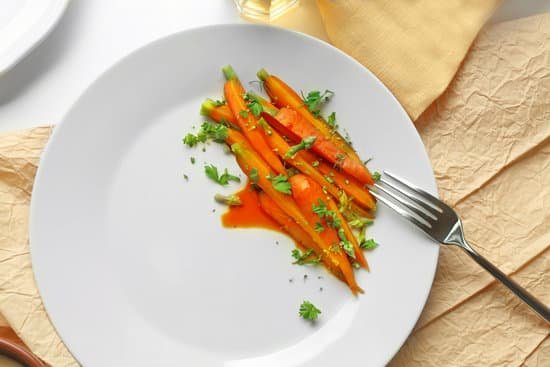 canva slices of carrots with herbs on plate MAD
