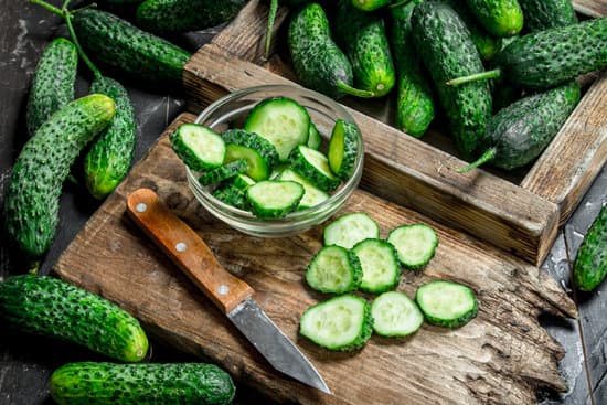 canva slices of cucumbers in a bowl and wooden board MAEP81jRoXc