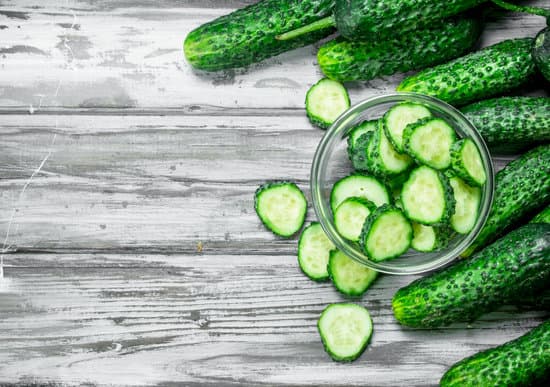 canva slices of cucumbers in a bowl flatlay MAEPWWhrhy0