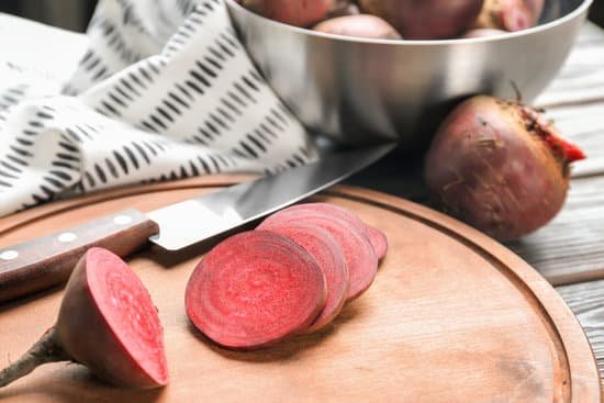 canva slices of fresh beet on cutting board MAD9brcAKtY