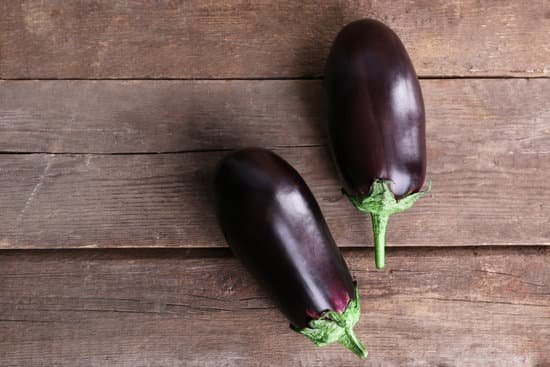 canva small eggplant on wooden background MAD MRJDEFI