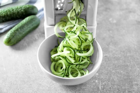 canva spiral vegetable slicer with cucumber spaghetti on table MAD9T5e1heI