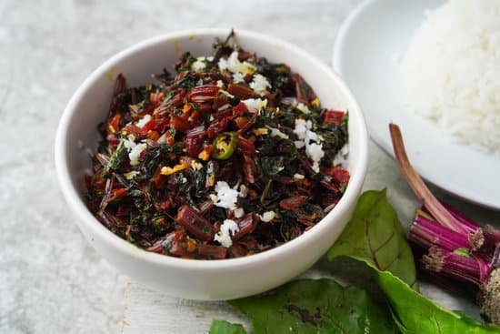 canva stir fried beet leaves in a bowl and rice MAD7ZmB9 Jk