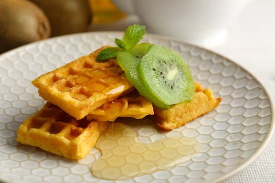 canva sweet homemade waffles with fresh kiwi fruit and honey MAD MquUc1U