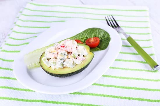 canva tasty salad in avocado on plate MAD L7riuWM