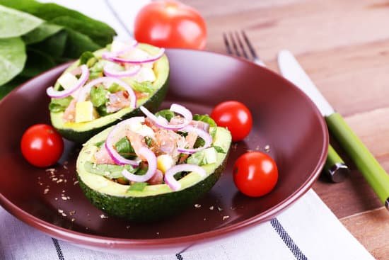 canva tasty salad in avocado on plate MAD LyE67oQ