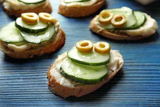 canva tasty sandwiches with fresh cucumber on table MAD9Twydgk0