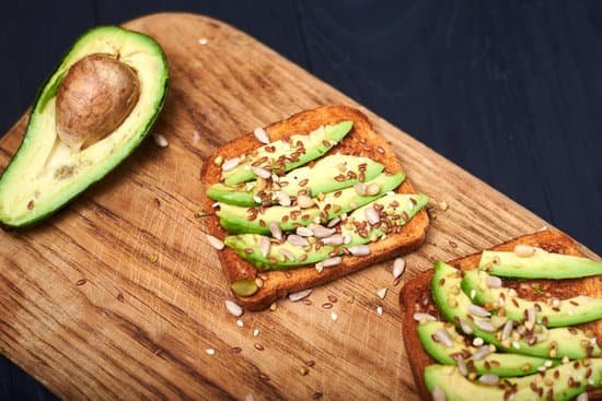 canva toasts with sliced avocado and mixture of seeds MAEEE QanOs