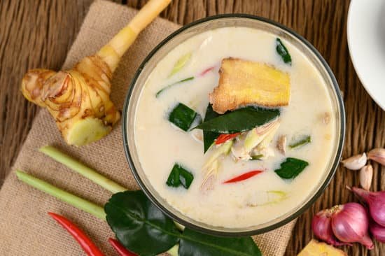 canva tom kha kai in a bowl with kaffir lime leaves lemongrass red o MAD pigMSAY