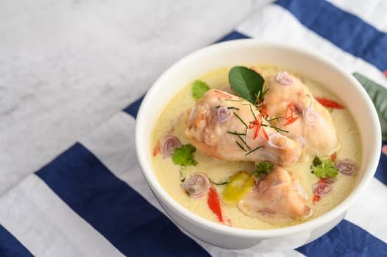 canva tom kha kai in a bowl with kaffir lime leaves lemongrass red o MAD2yFOScVA