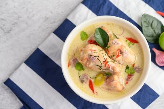 canva tom kha kai in a bowl with kaffir lime leaves lemongrass red o MAD2yKIfMz8