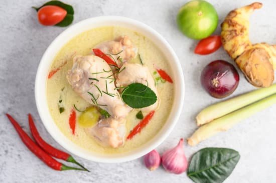 canva tom kha kai in a bowl with kaffir lime leaves lemongrass red o MAD2yPUK5kw