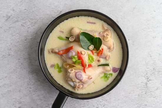 canva tom kha kai in a pan frying with kaffir lime leaves lemongrass MAD2yNZUJ7k