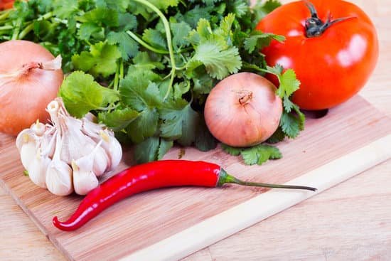 canva tomatoes garlic onion and cilantro.